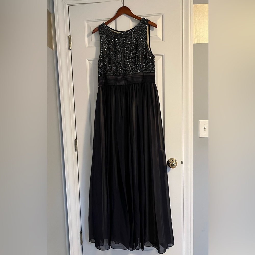 Full length navy blue gown.